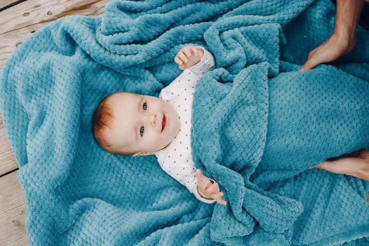 The Fabric of Sleep: A Parent’s Guide to Choosing the Right Swaddles and Blankets